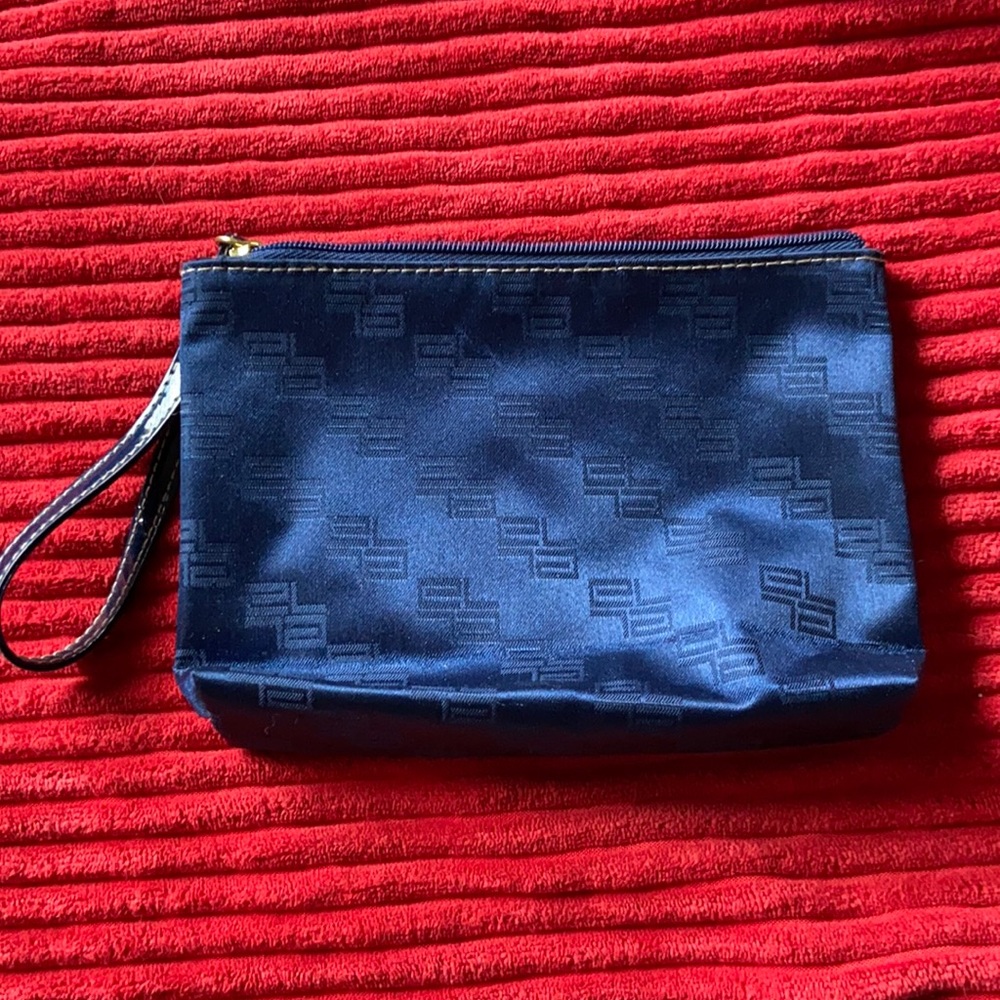 Navy blue zip top with wristlet handle